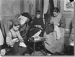 Photograph showing a Victorian family at work making trousers Image courtesy of wwweridingnet poorclothessml